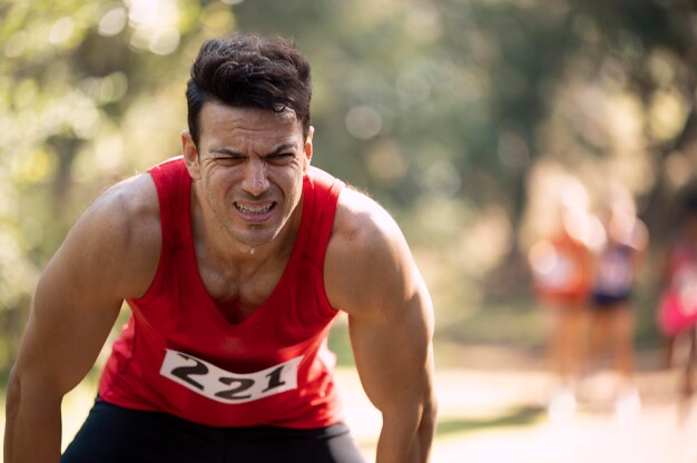 Athletic man participating in a cross country