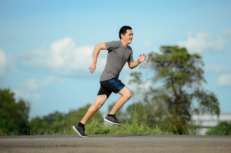 Man runner on the road to healthy, Young people running exercise on street.